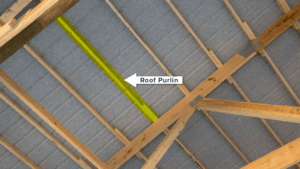 Steel purlin installation on industrial roof